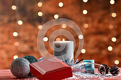 An assortment of Christmas decorations with an out of focus gift box and a champagne glass at the front. Christmas and decoration Stock Photo