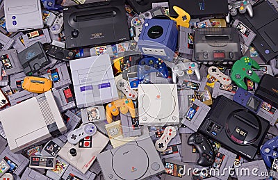 Assortment of Classic Retro Video Game Cartridges, Systems and Controllers Editorial Stock Photo