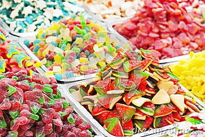 Assortment colorful gummy candies at market selective focus Stock Photo