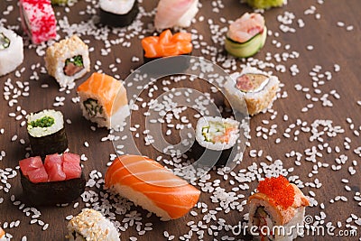 Assortment of colorful sushi and rolls background Stock Photo