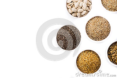 Assortment of different seeds in bowl isolated. Pumpkin, linen, chia, sunflower, and sesame seeds Stock Photo