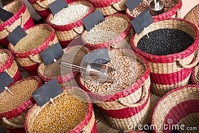 Assortment of dry beans packed in baskets on bazar Stock Photo