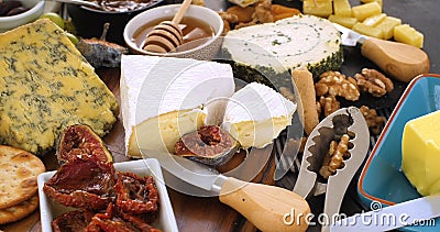 Assortment of French and British cheese with figs and walnuts Stock Photo