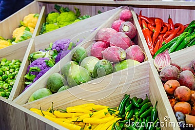 Assortment of fresh vegetables at market counter, vegetable shop, farmer marketplace. Organic, healthy, vegetarian diet food conce Stock Photo