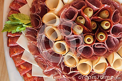 Assortment of processed meat with green olives Stock Photo