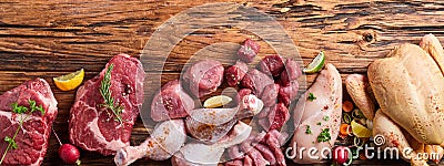 Assortment of raw meat on wooden table Stock Photo