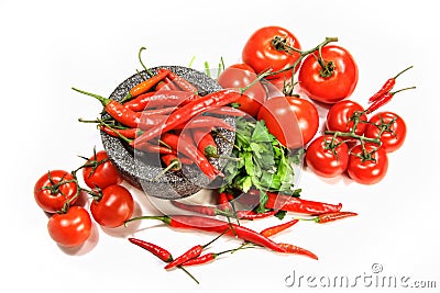 Assortment of red peppers and tomatoes on white Stock Photo