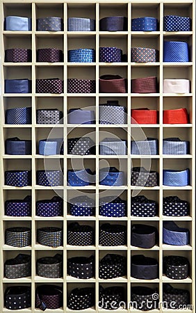 Assortment of rolled ties in a rack Stock Photo