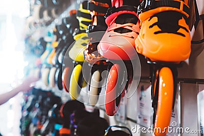 Assortment roller skates isolated in store shop, person choosing and buy color roller-skates on backgraund sun flare, healthy and Stock Photo