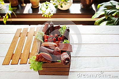 Assortment of sausages in wooden box copyspace Stock Photo