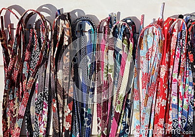 Assortment of shoelaces made with Chirimen cloth, japanese traditional kimono fabric. Stock Photo