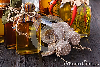 Assortment of spicy oils with herbs and spices in different bottles Stock Photo