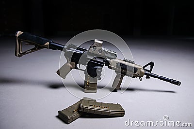 Assult rifle and magazines with bullets Stock Photo