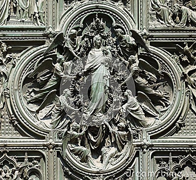 Assumption of the Virgin Mary, detail of the main bronze door of the Milan Cathedral Stock Photo