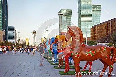 ASTANA, KAZAKHSTAN - JULY 25, 2017: Art installation with figures of horses painted in different ethnic ornament Editorial Stock Photo