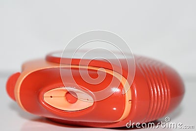 Asthma inhaler. Metered dose inhaler. Orange medication for asthma. Stock Photo