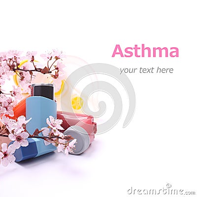 Asthma inhalers with extension tube for children and blossoming tree branches over white Stock Photo
