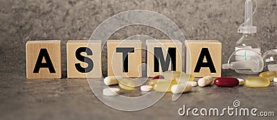 ASTMA as a text with letters, corona virus pandemic with word cubes on a dark grey background with space for text Stock Photo