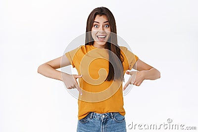 Astonished, excited good-looking girl cant wait shopping favorite store black friday, pointing fingers down, smiling Stock Photo