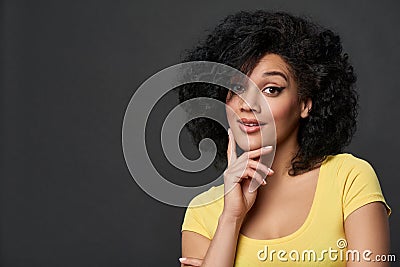 Astonished mixed race woman with rised eyebrows Stock Photo