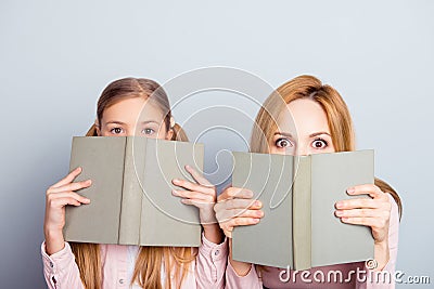 Astonished reaction of mother and daughter close half face with Stock Photo