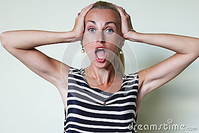 An astonished woman with open mouth Stock Photo