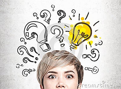 Astonished young woman and her bright idea Stock Photo