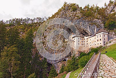 Astonishing landscape of medieval Predjama castle Slovene. Predjamski grad. Castle at the cave mouth Stock Photo