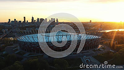 Astonishing sunrise over the Warsaw National stadium with purple sky and golden sun Editorial Stock Photo