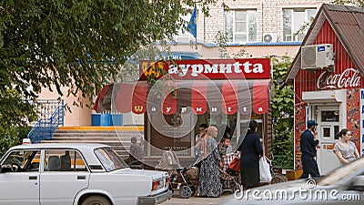 Astrakhan, Russia, May 24, 2016: Brand mimicry example. Local fast food using turned well known M of McDonald's in brand Editorial Stock Photo