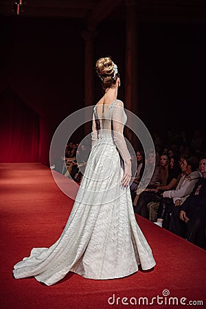 ASTRAKHAN RUSSIA - NOVEMBER 01, 2019. Caspian Fashion Week.Female models walk the runway in white wedding dresses Editorial Stock Photo