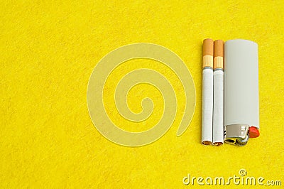 An astray with cigarettes and a ligther Stock Photo