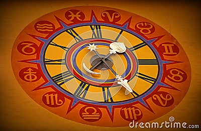 Astrological clock on the wall Stock Photo