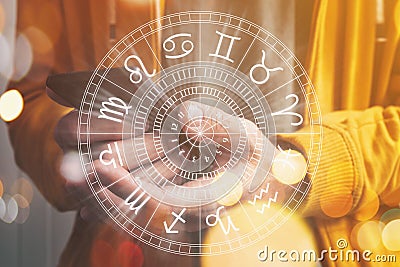 Astrology smartphone app concept, man using mobile phone, closeup of hands with astrological chart Stock Photo