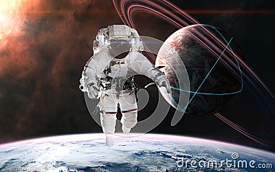 Astronaut on background of planets in deep space. Glowing structures on surface of planet with rings Stock Photo