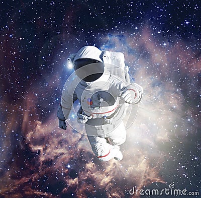 Astronaut exploring outer space conducting spacewalk Stock Photo