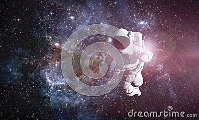 Astronaut exploring outer space conducting spacewalk Stock Photo