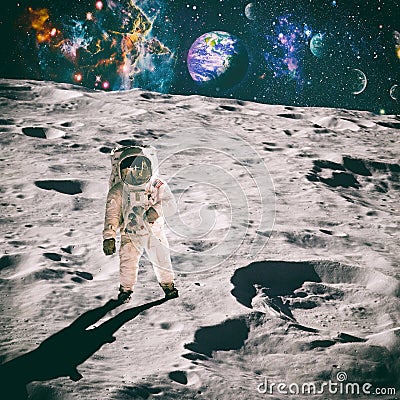 Astronaut looks up at an alien sun that illuminates the barren world he stands on. Elements of this image furnished by NASA Stock Photo