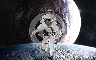 Astronaut in outer space in planetary orbit. Inhabited planet in deep space Stock Photo