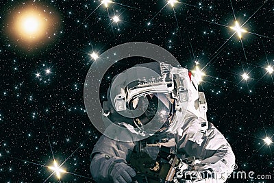 An astronaut poses against spectacular space view.The elements of this image furnished by NASA Stock Photo