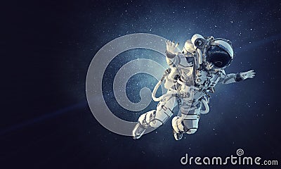 Astronaut on space mission. Mixed media Stock Photo