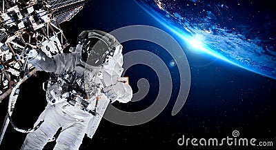 Astronaut spaceman do spacewalk while working for space station Stock Photo