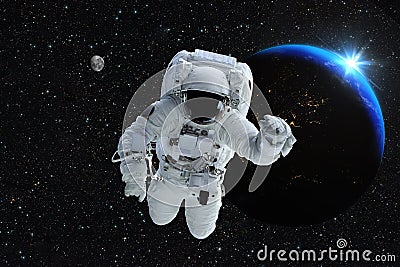 Astronaut spaceman outer space people planet earth moon. Beautiful blue sunrise. Elements of this image furnished by NASA. Stock Photo