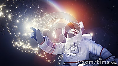 Astronaut spacewalk in space near Earth and pointing his finger Stock Photo