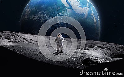 Astronaut on surface of the Moon. Earth on background. Stock Photo