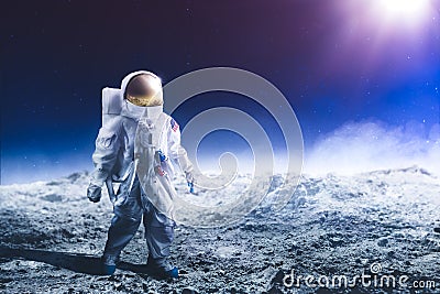 Astronaut walking on the moon Stock Photo