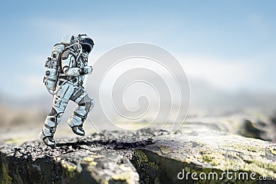 Astronaut walking on an unexplored planet Stock Photo