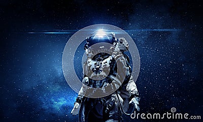 Astronaut walking on an unexplored planet Stock Photo