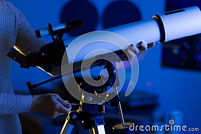 Astronomer man setting telescope at the night sky Stock Photo