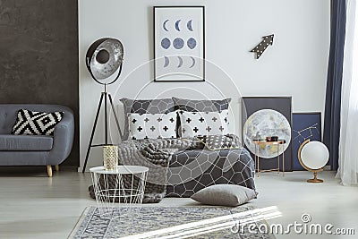 Astronomical posters in grey bedroom interior Stock Photo